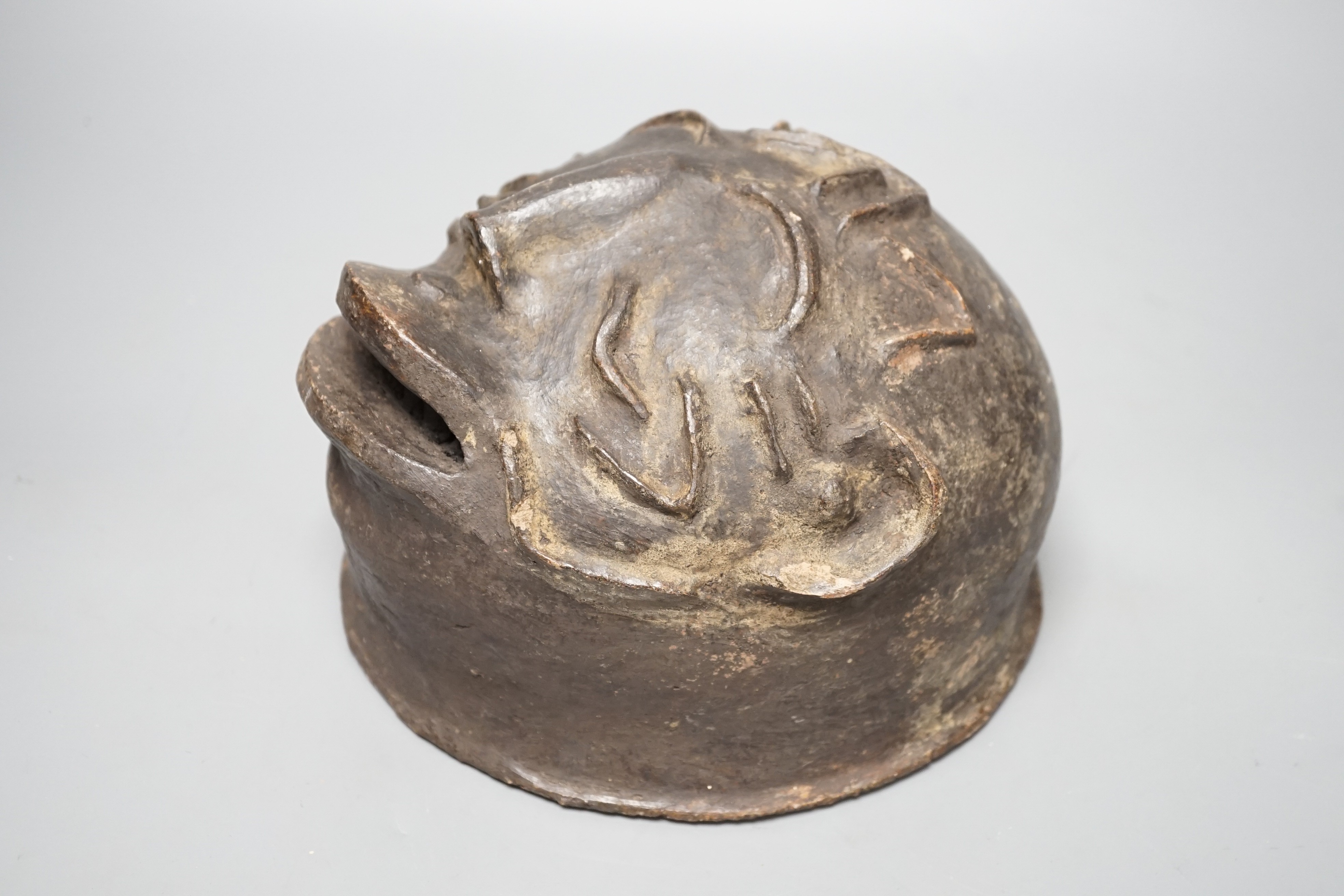 A terracotta Makonde helmet mask (Tanzanian) 21cm diameter